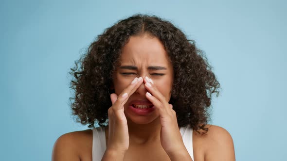 Sick Black Lady Touching Sore Nose Over Blue Background