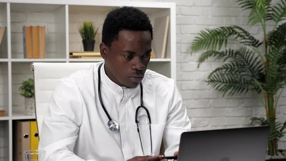 African American Man Online Doctor Talking to Patient Video Call Webcam Laptop