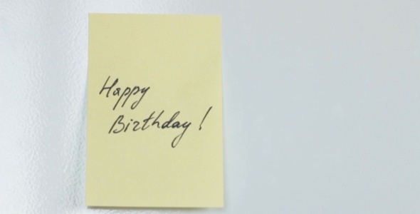 Happy Birthday Yellow Note on Fridge Door