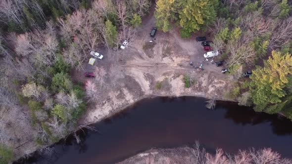 Overland Camping On Remote Forest Near Leota With Muskegon River In Michigan. - Aerial Shot