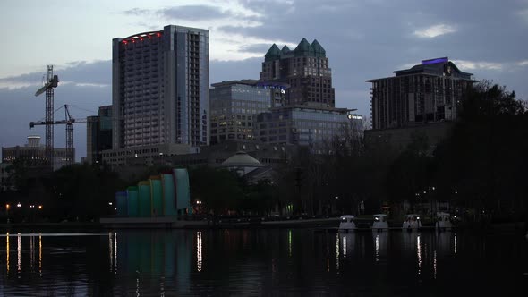 Tall buildings seen from Lake Eola at dusk