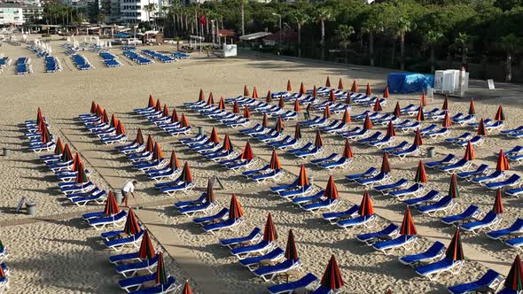 Empty sun loungers on the beach aerial view 4 K Turkey Alanya