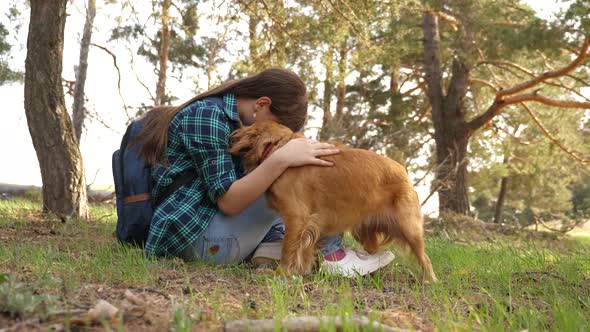 Sexy Breeder Girl Is Training a Dog. Woman Traveler with a Dog. Teamwork. Favorite Pet