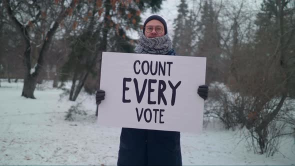 Demanding fair elections in a demonstration with a Count Every Vote poster