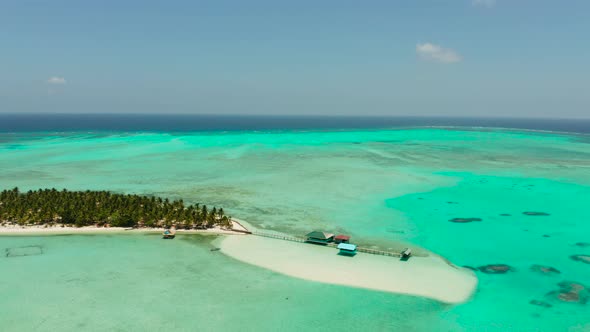 Tropical Island with a Beach on the Atoll