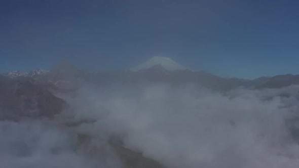 Aerial View of Clouds and Mountains at Sunrise