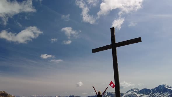 Woman on Top of Piz Scalottas Swiss Flag