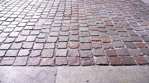 Grey Pavement with Terracotta Elements Reflecting Sunlight