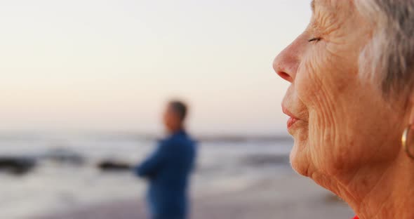 Senior couple standing in the beach 4k