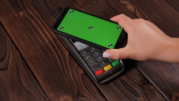 Clear Green Mockup Screen Template of Phone and Pos Terminal on Wooden Desk