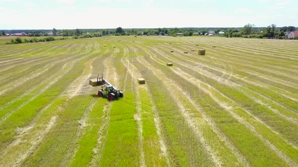 Tractor Collects Hay On The Field