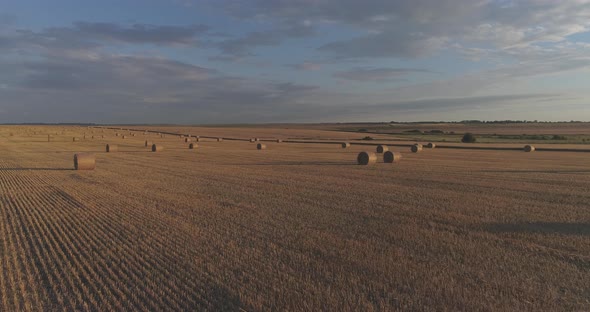 Aerial shot of a field with bales of hay