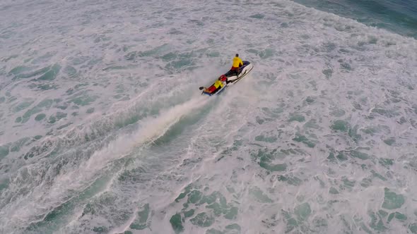 Aerial view of lifeguard surf rescue jet ski personal watercraft in Hawaii