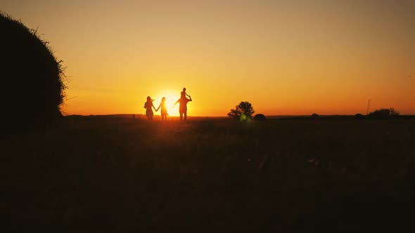 Family Silhouette with Sunset