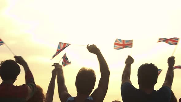 Group of People Waving with British Flags