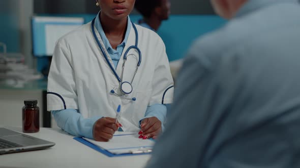 Close Up of African American Doctor Doing Consultation