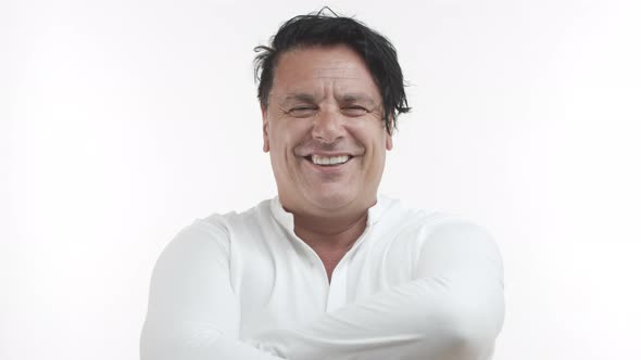 Closeup of Happy Middleaged Chubby Man in White Casual Shirt Laughing Over Something Funny Smiling