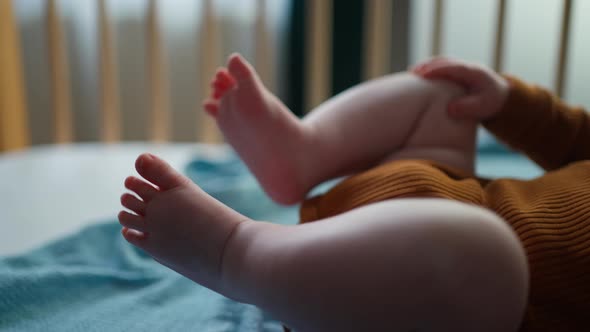 Top View of Baby's Feet in Crib