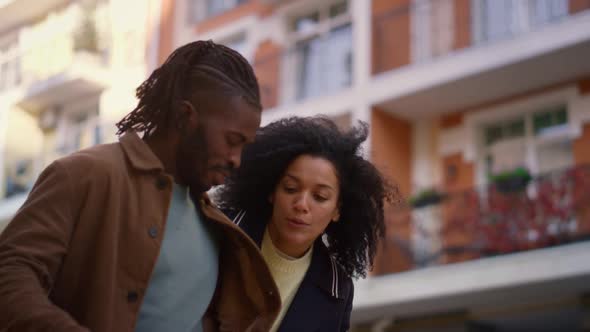 Joyful Couple Walking Talking About Shopping Portrait