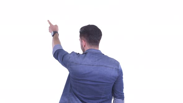 Rear View of Young Bearded Hipster Man Pointing Finger