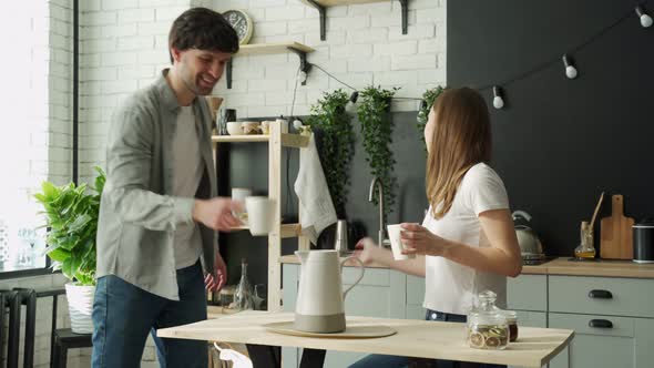 Young Couple Enjoying a Coffee Break Together