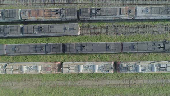 Aerial Top Down Shot of an Abandoned Rusty Locomotives and Old Railways