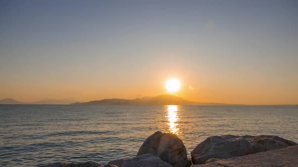 Sun Rises behind the Island