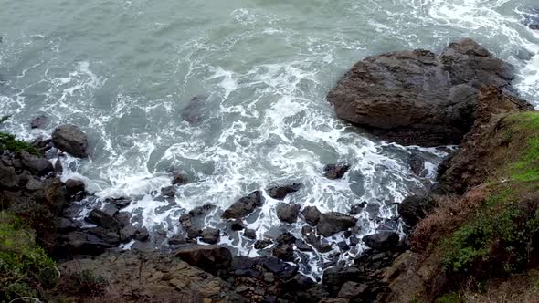 Rugged coastline of waves, rocks and water on the mainland near infamous abandoned Alcatraz military