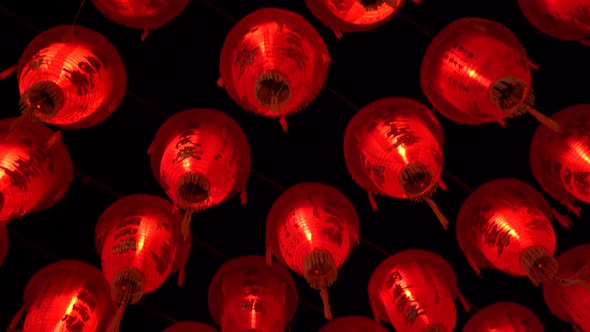 A close up footage of Chinese traditional red lanterns hanging up on the sky, symbolising love, brig