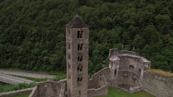 Aerial around old medieval clock tower in a castle in Mesocco, Switzerland.