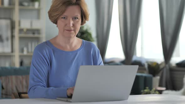 Inviting Gesture By Old Senior Woman at Work