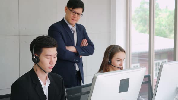 Business People Wearing Headset Working in Office