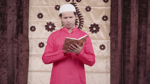 Muslim man reading poetry