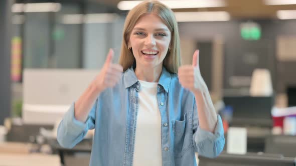 Young Woman Showing Thumbs Up Sign