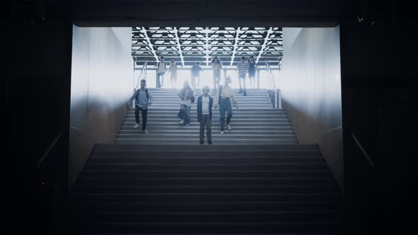 Group Pupils Running Downstairs Passing Upset Boy