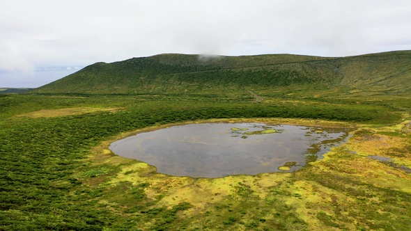 A lake in the crater of volcano. Sao Miguel island, Portugal.Aerial view of volcanic landscapes.