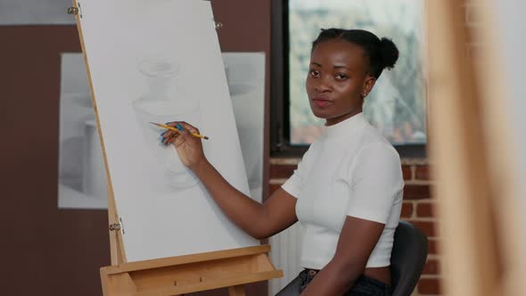 Portrait of Young Woman Using Pencil to Draw Inspiration Object