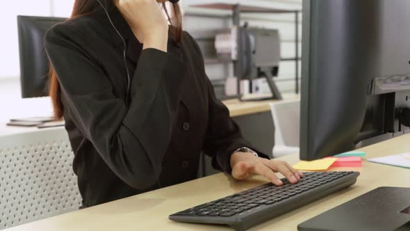 Business People Wearing Headset Working in Office