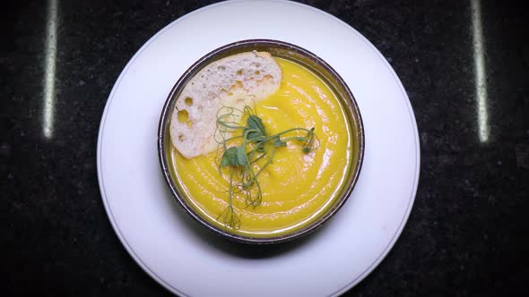 Pumpkin Cream Soup Decorated with Greens