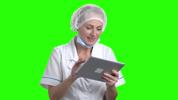 Smiling Doctor Using Digital Tablet