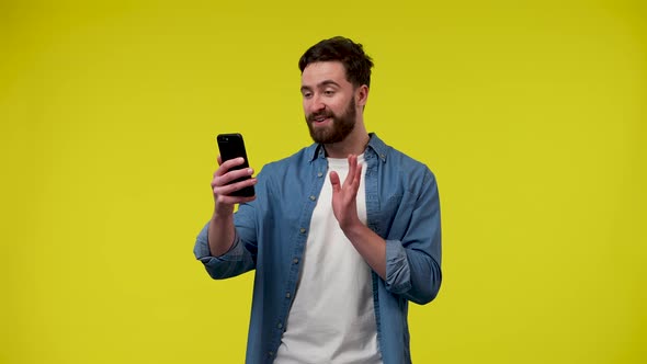 A Man Making a Video Call on His Phone
