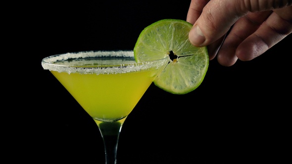 Cocktail Making Lime Slice Added To Drink