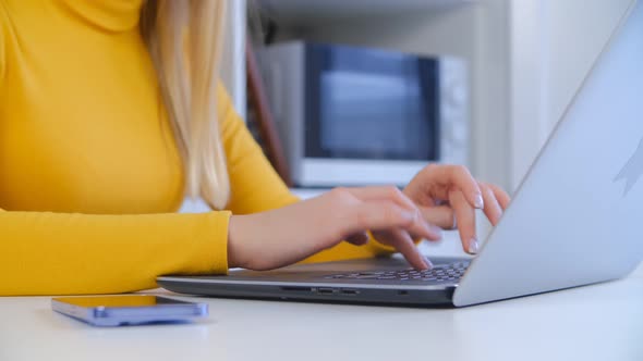 Young woman working on notebook computer at home on lockdown in 4k stock footage