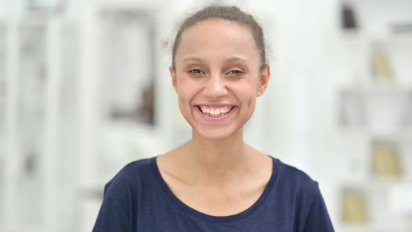 Portrait of Smiling African Woman Looking at Camera