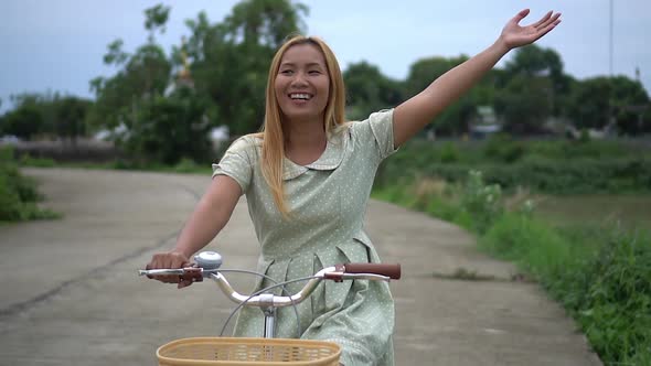 woman riding a bike on the park