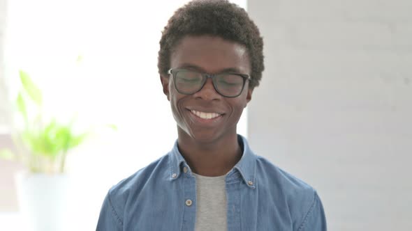 Portrait of Young African Man Shaking Head in Approval