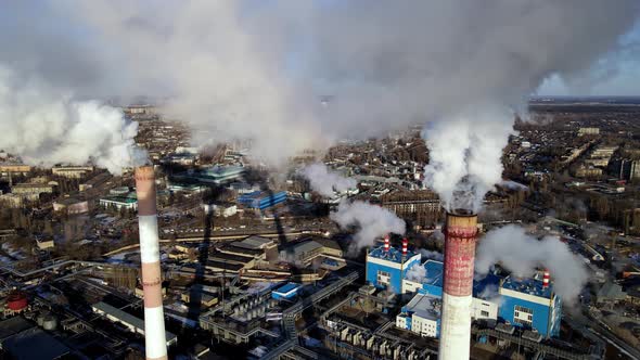 Industrial factory emissions of carbon gases with smoke in atmosphere