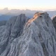Dolomites mountains peaks with a hiking path on a summer sunrise - VideoHive Item for Sale