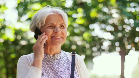 Senior Woman Calling on Smartphone in Park