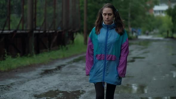 Girl Walking After Rain With Pigtails on the Head